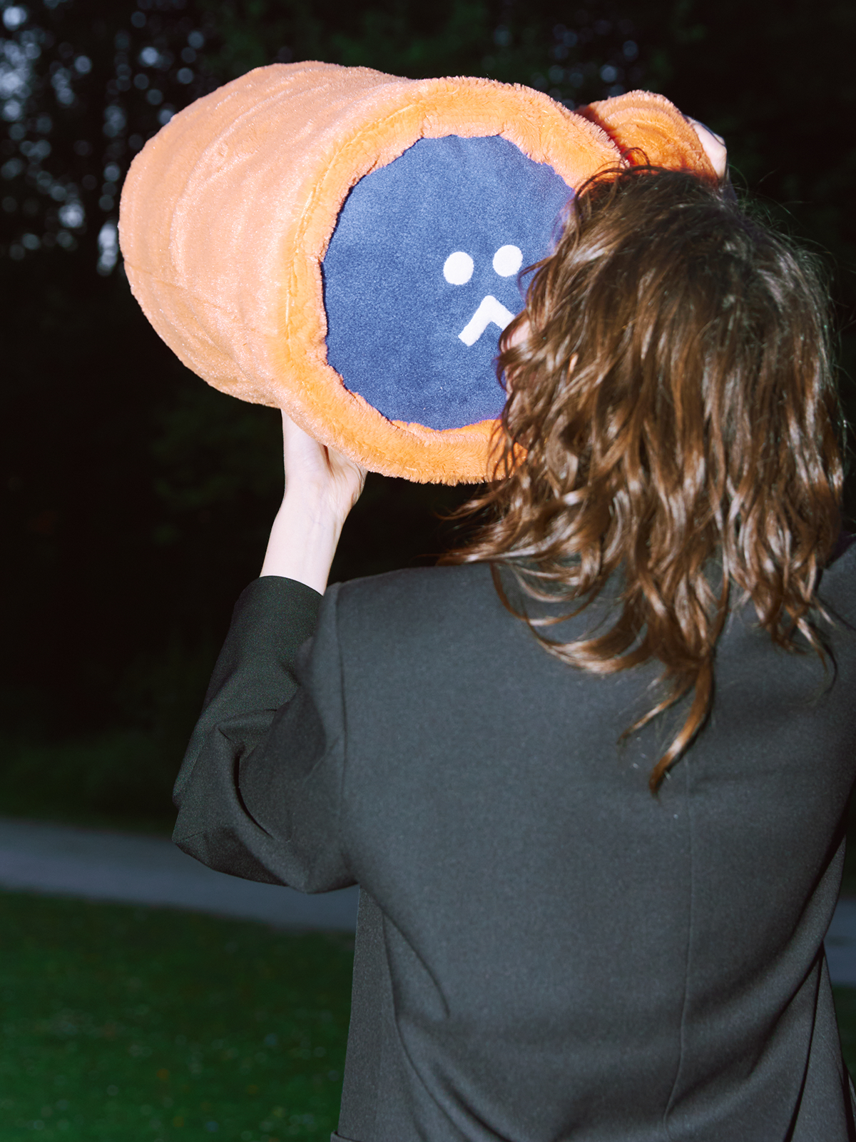 girl looking on a plush toy